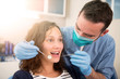 © Production Perig - Young attractive woman being cured by a dentist