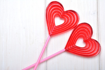 Lollipops in the shape of the heart on a white background