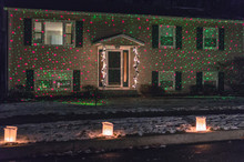 White Bag Lit Luminaries Light Up The Sidewalk Of A Home With Night Stars Landscape Lights 
