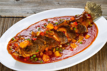 Fried Whole Fish In Sauce With Fruit And Vegetables 