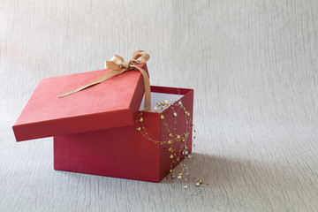 red gift box for someone special on wood background