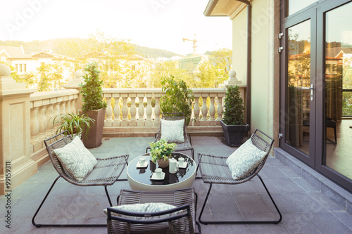 Fotografie, Obraz sunlight and table and chairs in modern balcony