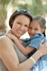 Wall Mural - mother with daughter near hotel