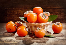 Fresh Persimmons In A Basket