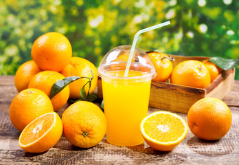 Wall Mural - glass of orange juice with fresh fruits