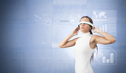 Wall Mural - Beautiful woman with futuristic glasses