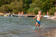 © rades - Little boy running water.