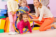 © Sergey Novikov - Kids with girl and teacher play active game