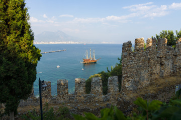 Wall Mural - View of sea port of Alanya. In the foreground the ruins of an ancient fortress. Turkey.