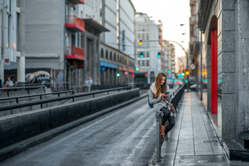 Woman with phone in the city