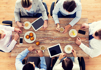 Poster - close up of business team drinking coffee on lunch