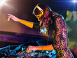 Beautiful DJ girl mixing electronic music