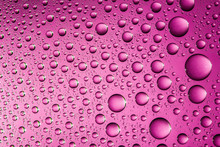 Pink Water Drops On Glass Surface Texture.