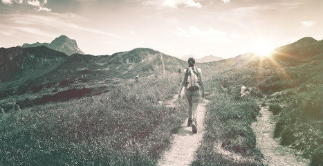 Wall Mural - active woman hiking in the mountains