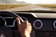 © Monkey Business - Close Up Of Driver's Hands On Car Steering Wheel
