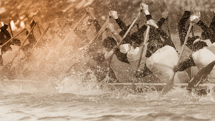 Close up of rowing team race with vintage color tone