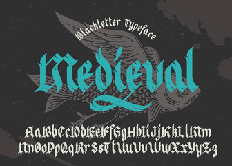 Wall Mural - Gothic medieval typeface. Black-letter fracture font with flying fish illustration.