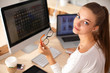 © shefkate - Young woman working in office, sitting at desk