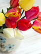 tulip bouquet on white wooden background