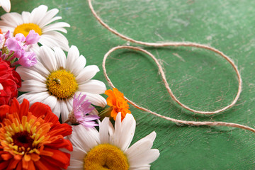 Sticker - Fresh colorful flowers on wooden table, closeup