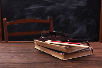 Canvas Print - Books and school accessories on wooden table