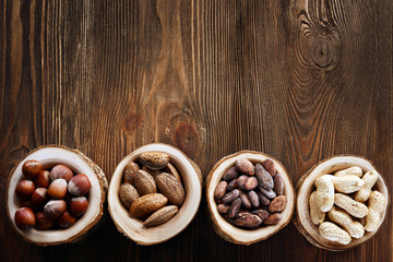 Wall Mural - Assortment of tasty nuts on wooden background