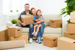 © JenkoAtaman - moving to new home. Happy family with cardboard boxes