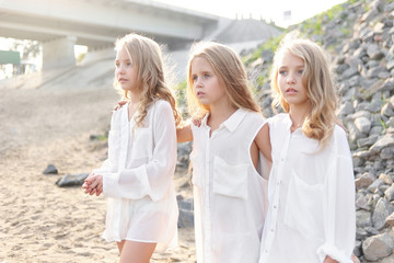 portrait of three girlfriends on the nature