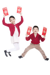 Wall Mural - Lively girl and boy jumping with red pockets in hands