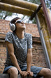Young man listening to music on headphones
