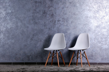 Sticker - Stylish conception with two white chairs on grey background