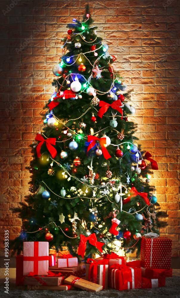 Christmas tree with presents in a room