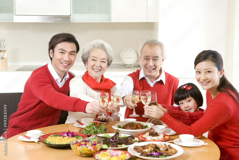 Three generations enjoying a Chinese New Year dinner together Stock ...