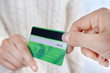 © Africa Studio - Hands holding a credit card