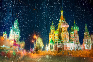 Fototapete - Moscow,Russia,Red square,view of St. Basil's Cathedral at rainy night, through wet window