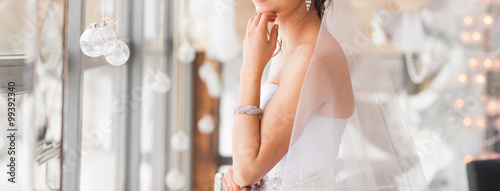 Fotomural valentine's day, bridal, wedding, christmas, x-mas, winter, happiness concept - bride looking at window