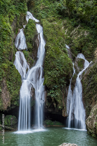 Fototapeta na wymiar Waterfall in a lush rainforest. Vegas grande waterfall in Topes de Collante, Trinidad, Cuba
