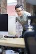 © Blue Jean Images - Businessman working on desktop computer in office
