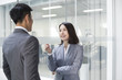 © Blue Jean Images - Business person talking in office