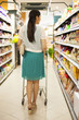 Young woman shopping in supermarket