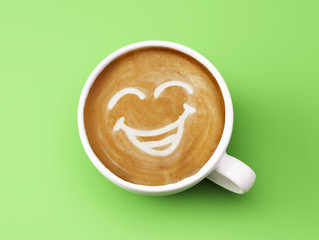 Fototapete - Face Laughing Coffee Cup Concept isolated on green background