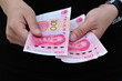 Hands with chinese yuan money