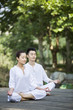 © Blue Jean Images - Young couple practicing yoga