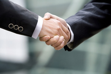 Close-up of businessmen shaking hands