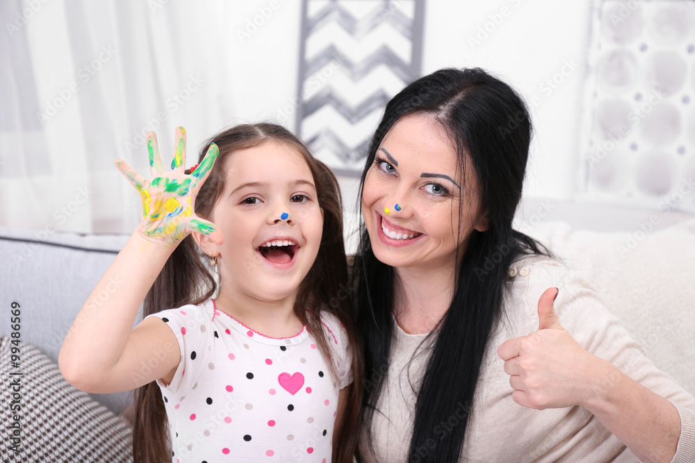 Mother and daughter playing in the room