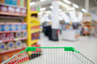 © Kwangmoozaa - shopping cart in department store blurred with bokeh background