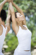 © Blue Jean Images - Young couple practicing yoga