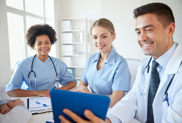 Sticker - happy doctors with tablet pc meeting at hospital