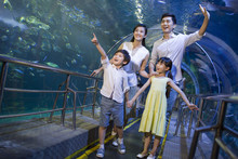 Young Family In Aquarium