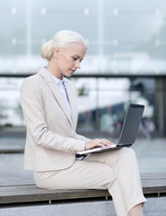 Sticker - businesswoman working with laptop outdoors